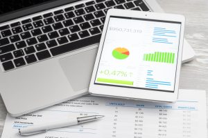 Charts and figures with laptop